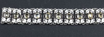 Articulated silver bracelet stylizing foliage...
