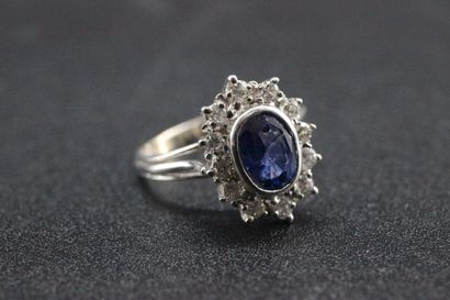 18k white gold daisy ring set with a sapphire...