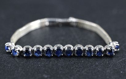 Silver bracelet set with 12 blue stones....