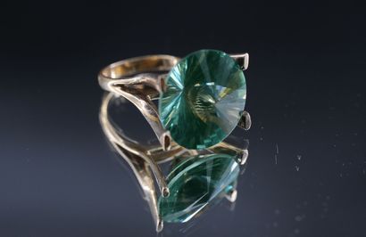 14K yellow gold ring set with a large stylized...