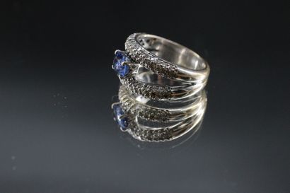 18k white gold ring set with a sapphire and...