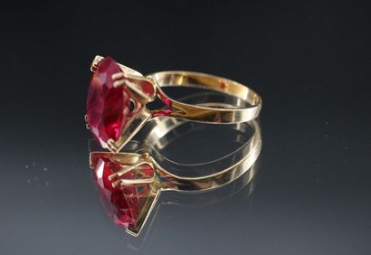 18k yellow gold ring set with a treated ruby....