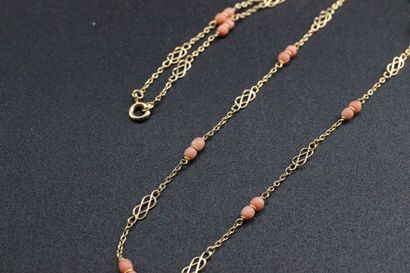 Yellow gold necklace set with angel coral,...