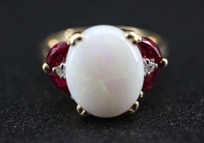 18k yellow gold ring set with a milky opal...