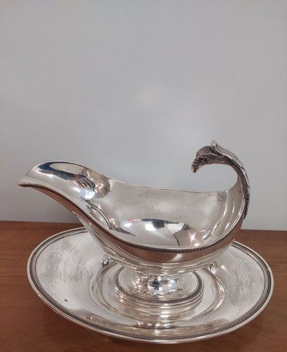 Saucière casque and its tray in solid silver...