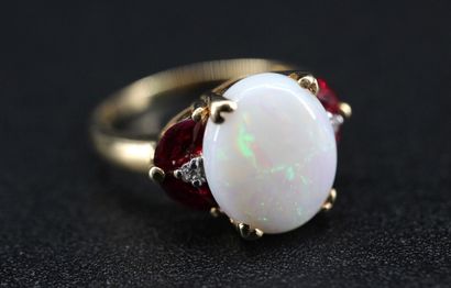 18k yellow gold ring set with a milky opal...