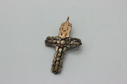 Silver cross, set in yellow gold, adorned...