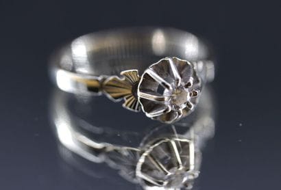 18k white gold ring set with a diamond weighing...