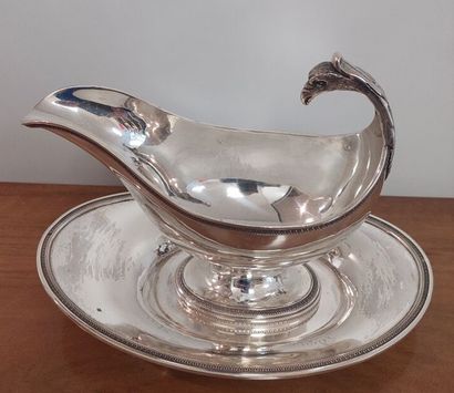 Saucière casque and its tray in solid silver...