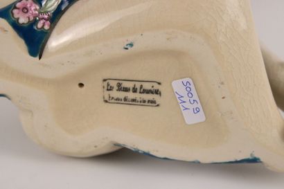 Louviere. Seated woman in cracked ceramic,...