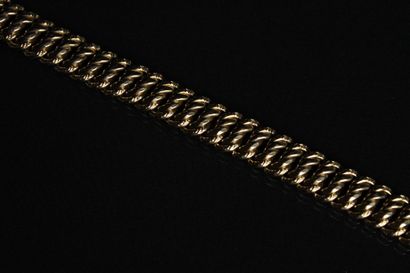 Bracelet en or jaune 18K (750/1000) à mailles...