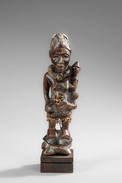 Kongo mother carrying her child on her side
Wood,...