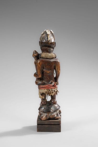 Kongo mother carrying her child on her side
Wood,...