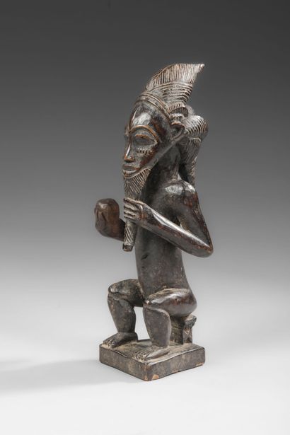 BAOULE - Seated ancestor with attributes...