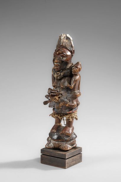 Kongo mother carrying her child on her side
Wood,...