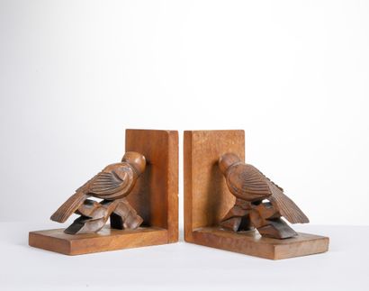 Paire de serres-livres aux oiseaux sculptés...