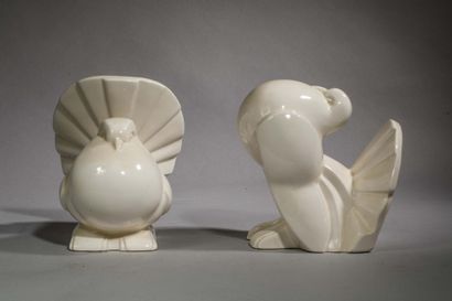 Pair of white glazed earthenware bookends...