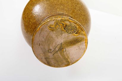 ACCOLAY 
Ochre-glazed ceramic spoon, broken...