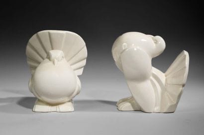 Pair of white glazed earthenware bookends...