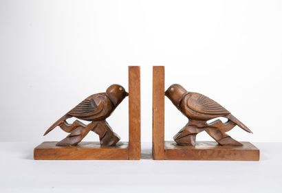 Paire de serres-livres aux oiseaux sculptés...