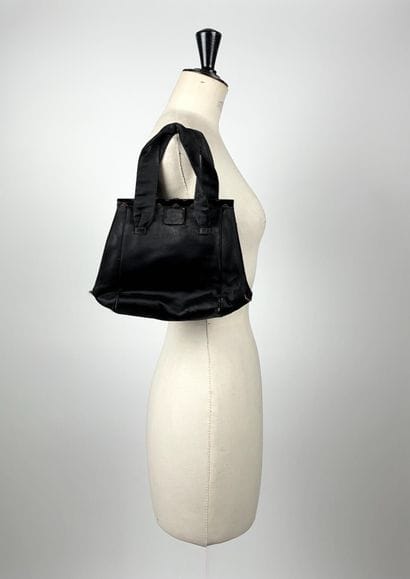 GUERLAIN
Chocolate canvas bag with oval woven...