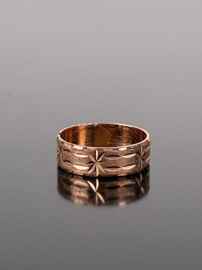 A ring in finely chased gold-plated metal...