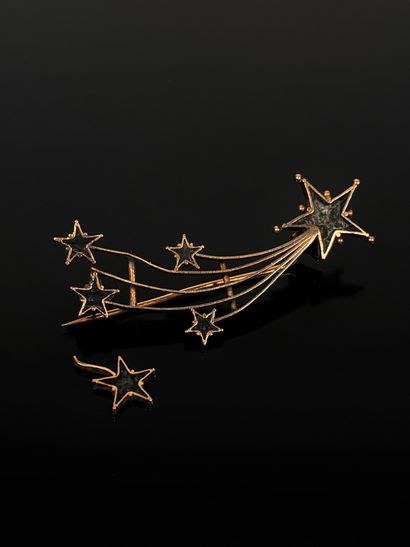 Shooting stars brooch in pink gold 
Slightly...