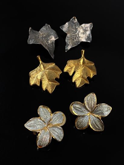 Set of five metal ear clips featuring flowers...