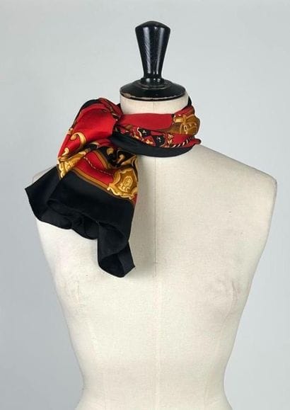 Set of two silk squares including: 
- Red,...