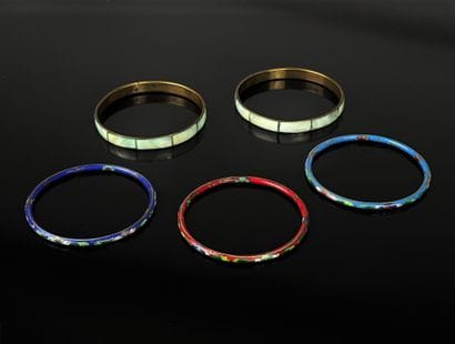Set of five rushes, two in mother-of-pearl...