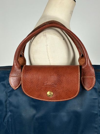 LONGCHAMP
Folding large model navy blue 
37...