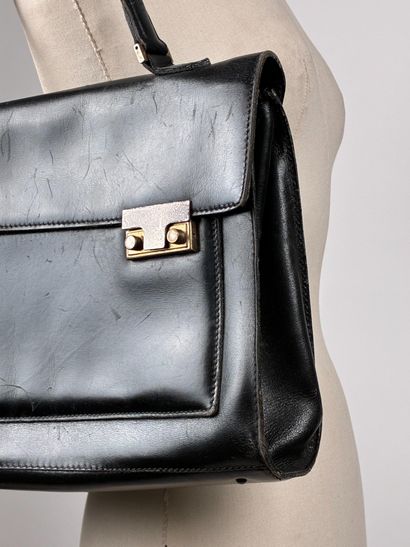 Dans le Goût de LANCEL
Sac cartable en cuir...