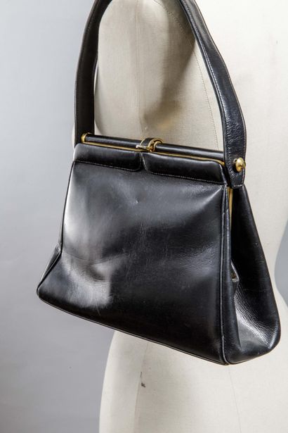 Petit sac noir doublé cuir
Travail des années...
