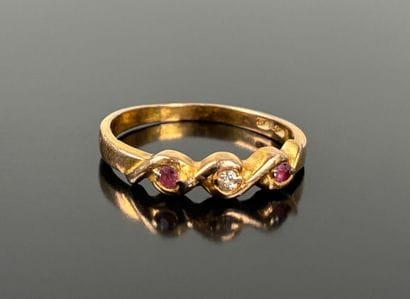 Gold-plated ring set with two red stones...
