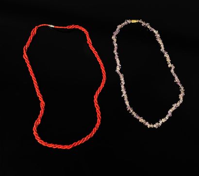 Two necklaces, one in coral beads and the...