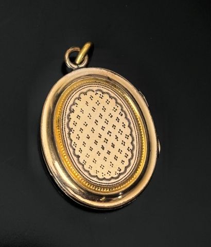 Gilded metal medallion pendant engraved with...