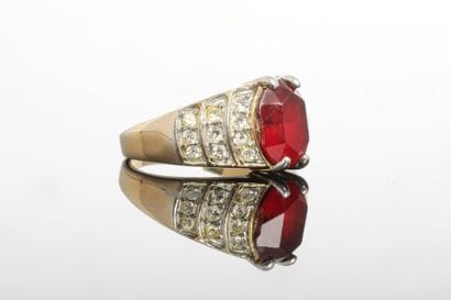 Gilded metal ring set with a verrotized red...