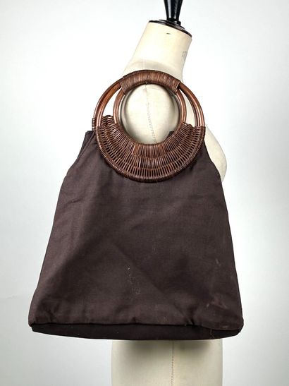 GUERLAIN
Chocolate canvas bag with oval woven...