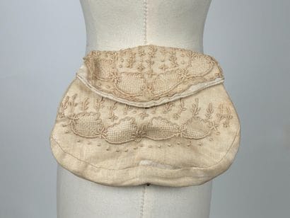 GUERLAIN
Chocolate canvas bag with oval woven...