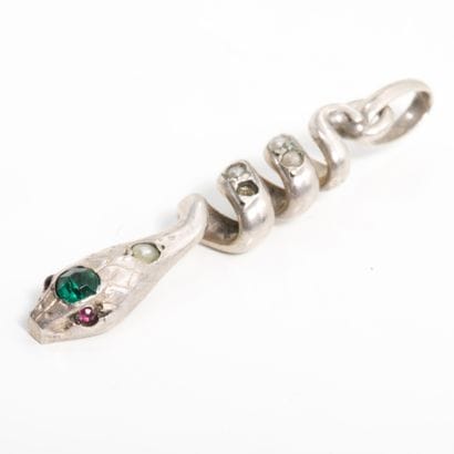 Silver snake pendant with synthetic ruby...
