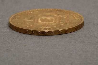 Une pièce de 100 francs or Napoléon III tête...