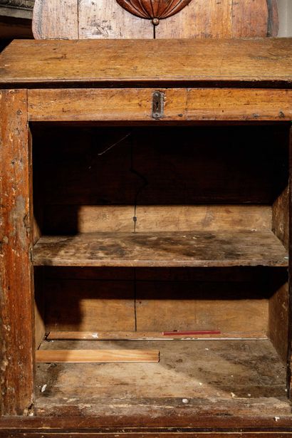 A carved, molded oak oratory surmounted by...