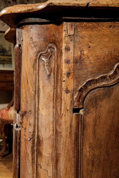 A tomb-shaped chest of drawers made of natural,...