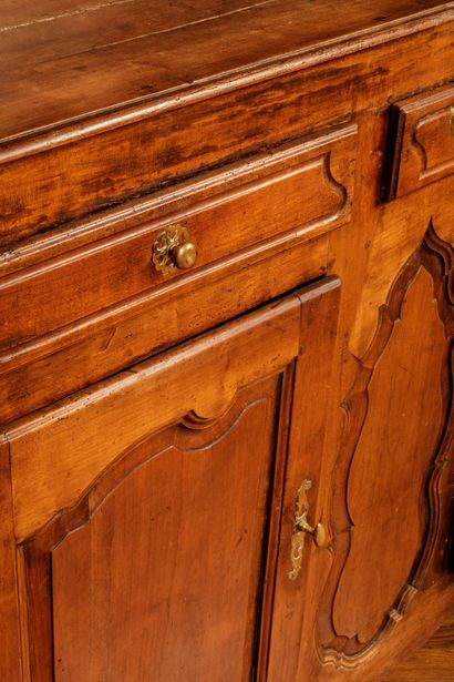 Natural wood sideboard with molded and carved...