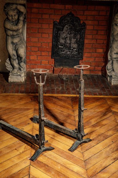 Pair of cast-iron side tables with lightly...
