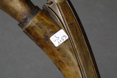 A large wooden and horn pipe with a bowl...