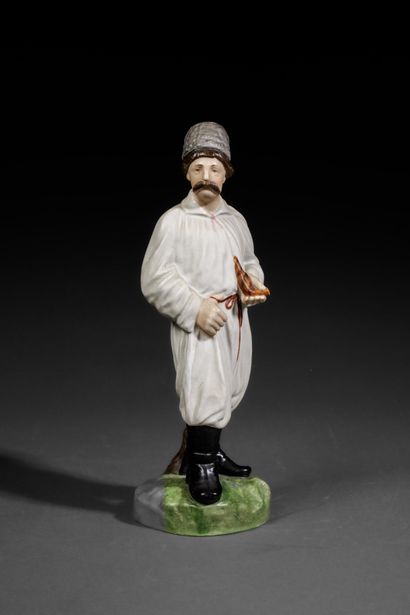 Polychrome porcelain figurine depicting a...