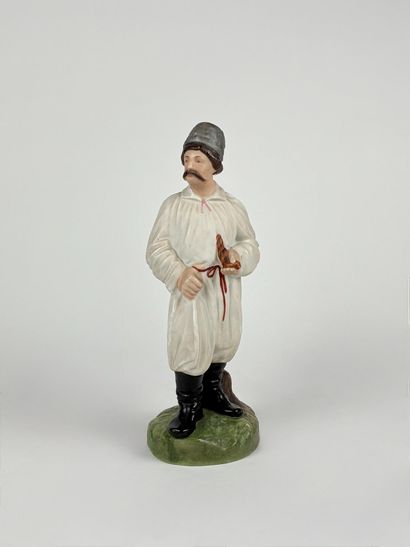 Polychrome porcelain figurine depicting a...