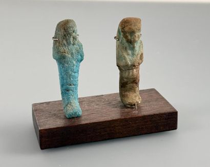 Two uninscribed ushabti figures depicting...
