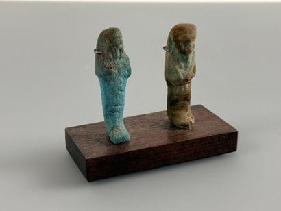 Two uninscribed ushabti figures depicting...
